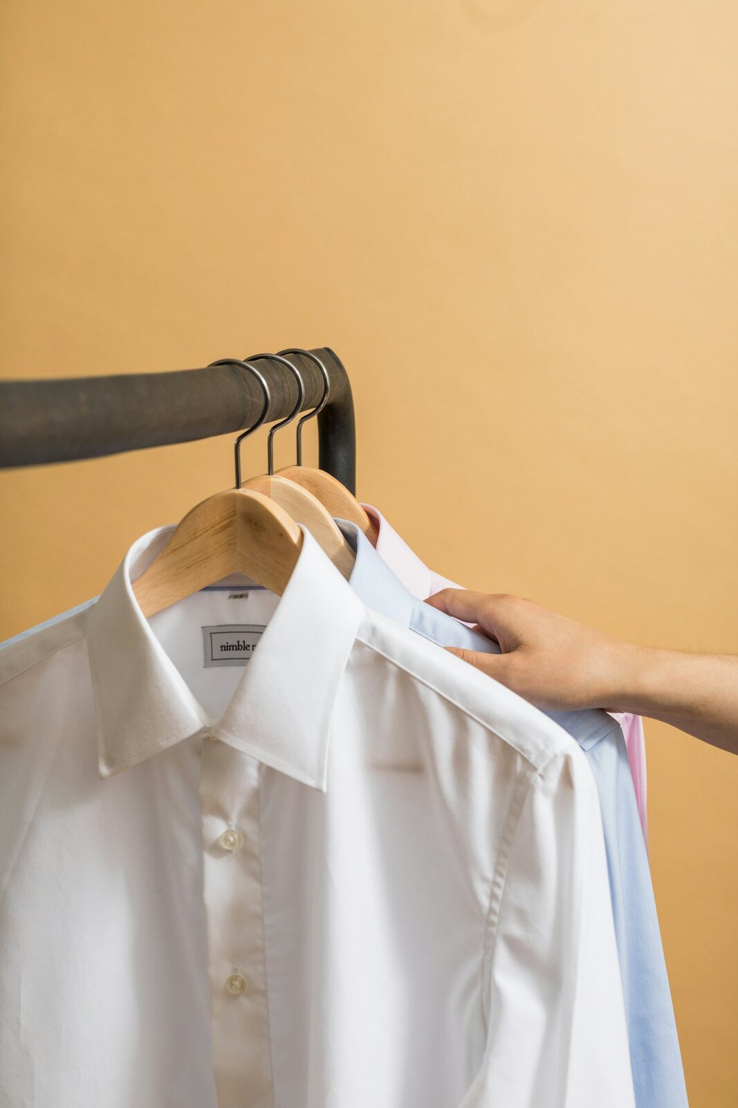 Freshly pressed white dress shirt on a hanger