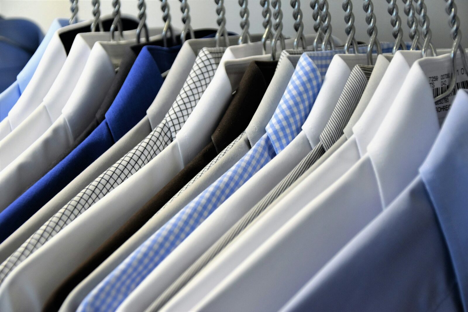 Row of pressed dress shirts ready for pickup